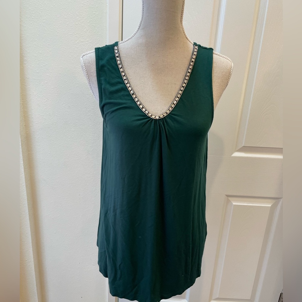 Emerald green knit tank top with rich rhinestone detail along V neck neckline